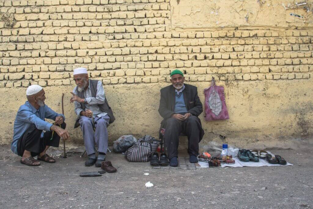 Aghanistani men in Qom, Iran. Photo by Javad Esmaeili via Unsplash.