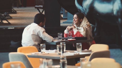 Ask An Iranian - Couple sitting drinking coffee in a café in Tehran, Iran